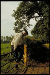 Krishnaji going over a fence in Brockwood